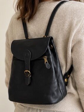 Beautiful IL Bisonte black leather mini backpack with a timeless, minimalist de